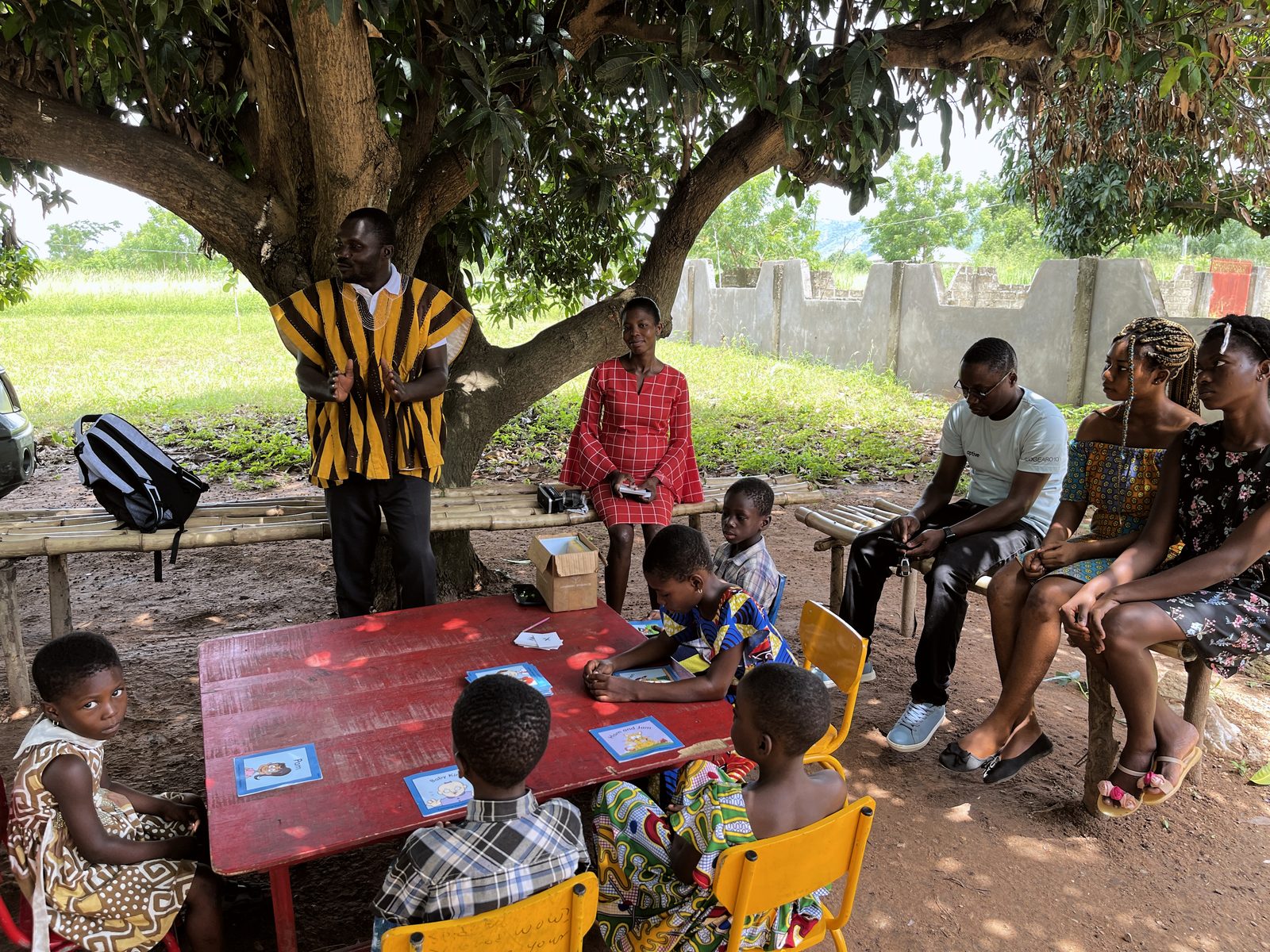 A reading lesson under the mango tree